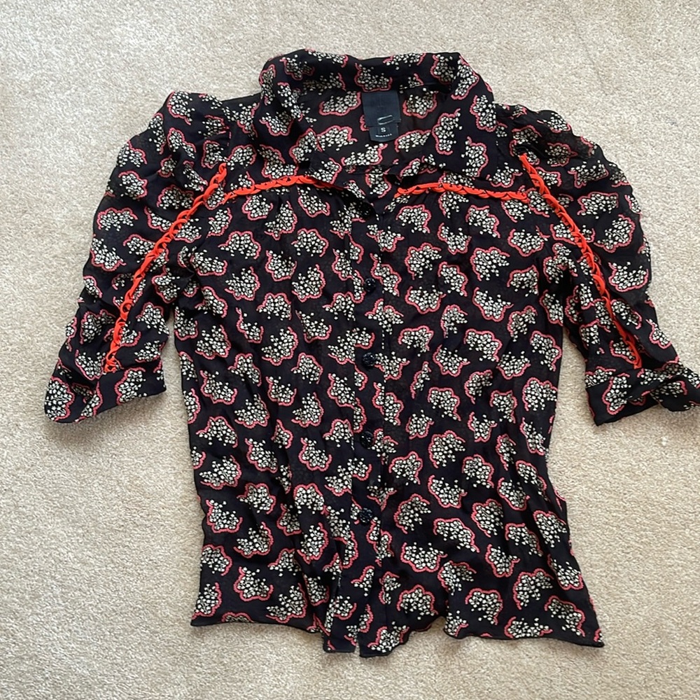 Anna Sui black patterned blouse with red piping.